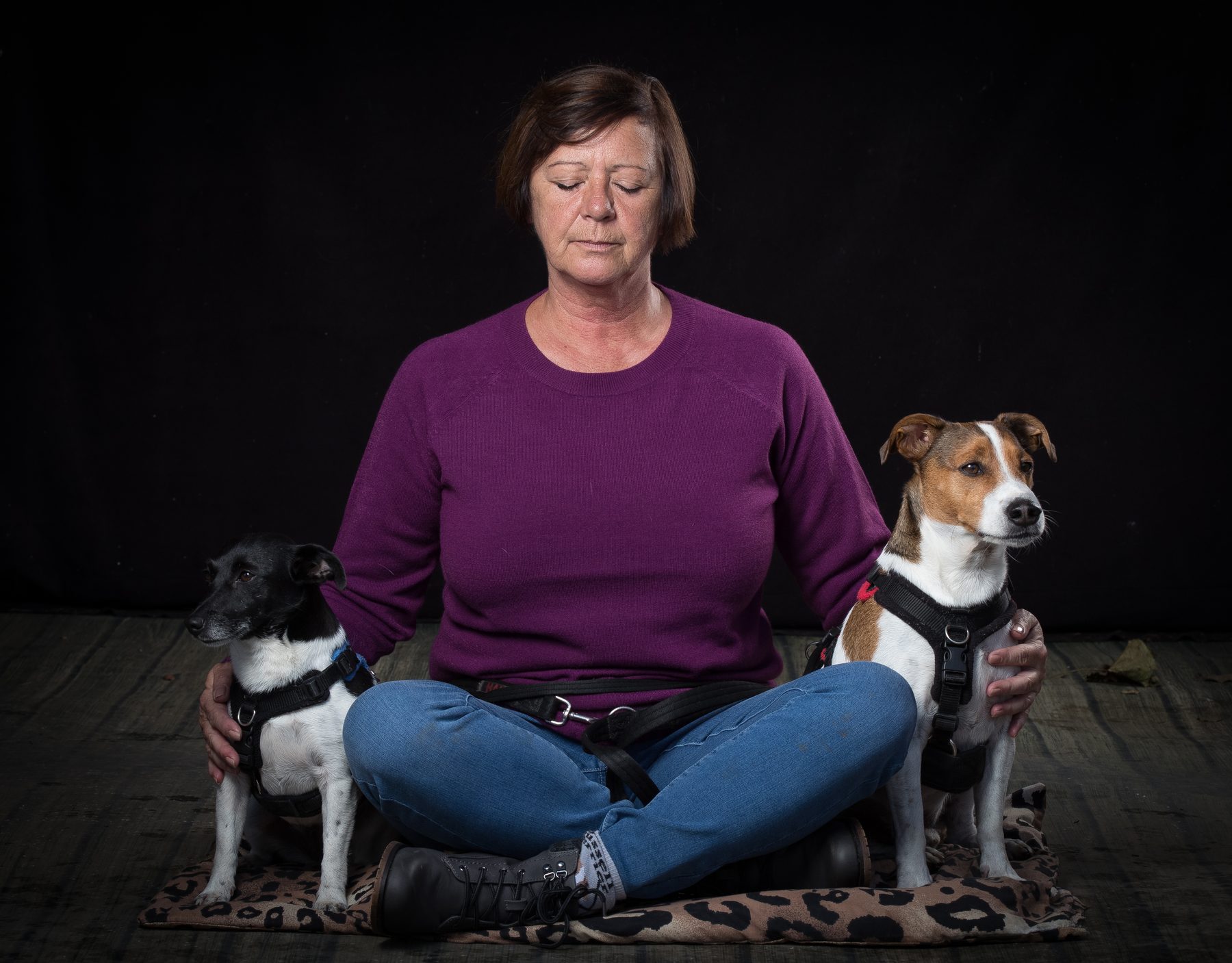 Dawn sitting cross-legged with her eyes closed, with Millie and Mylo beside her
